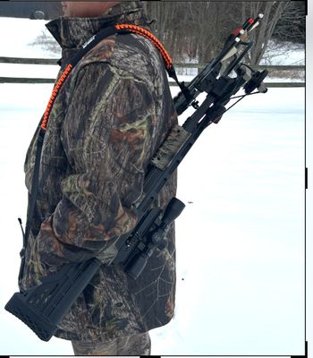 A hunter carrying a crossbow on a sling